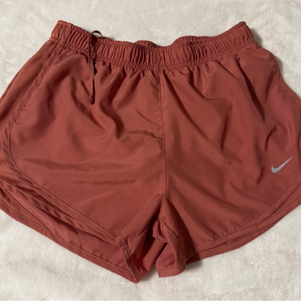 Rust colored Nike shorts with attached brief